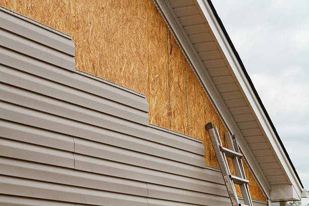 Professional Emergency Siding Repair technician working in Loudonville, OH